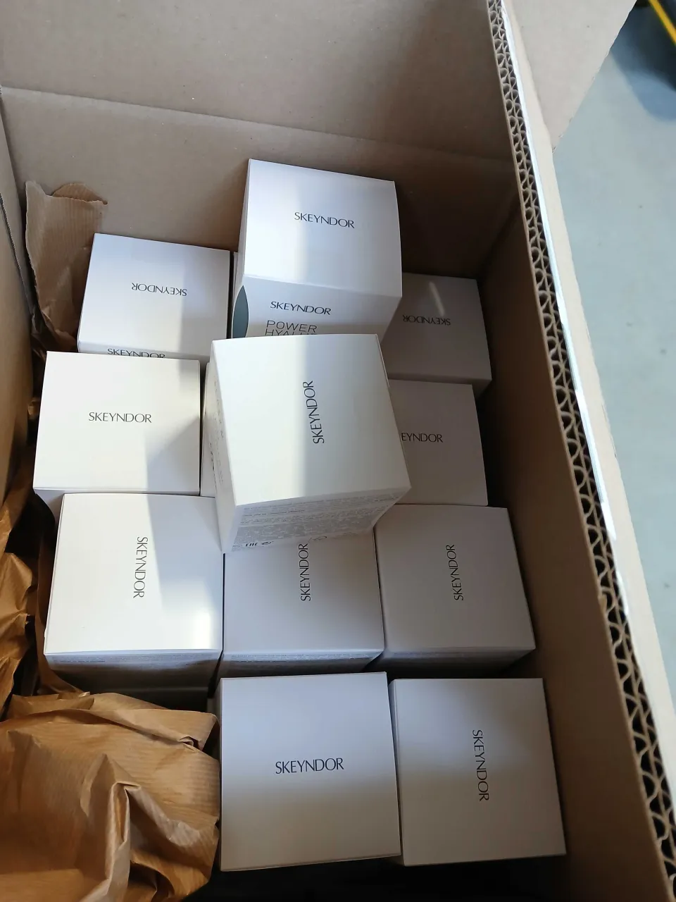 KRINOVA warehouse operations: skincare cartons ready for packing